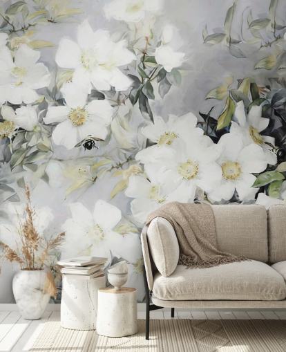 Grey background with white flowers and muted green leaves