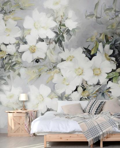 Grey background with white flowers and muted green leaves