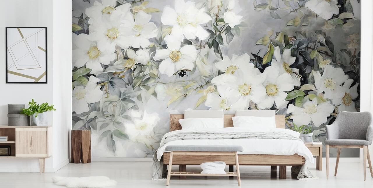 Grey background with white flowers and muted green leaves