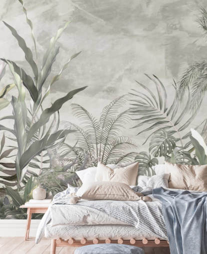 Green and gray jungle leaves and branches on a misty wallpaper