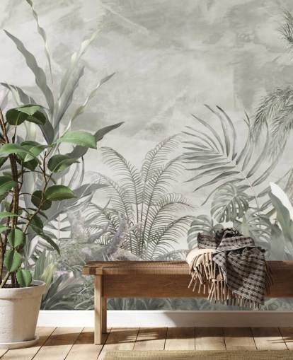 Green and grey jungle leaves and branches on a misty wallpaper