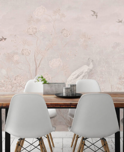 Light pink faded vintage wallpaper in a chinoiserie style with soft grownig vines and white crane birds and peacocks