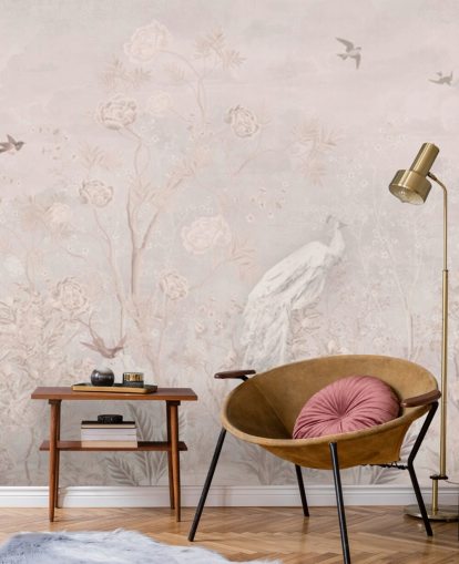 Light pink faded vintage wallpaper in a chinoiserie style with soft grownig vines and white crane birds and peacocks