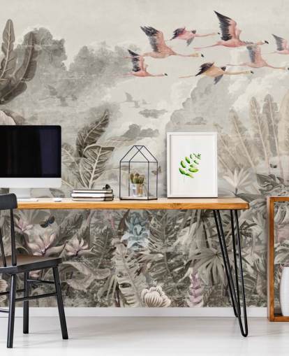 Muted green palm trees and jungle trees with light pink flowers and flying pink flamingo birds wallpaper