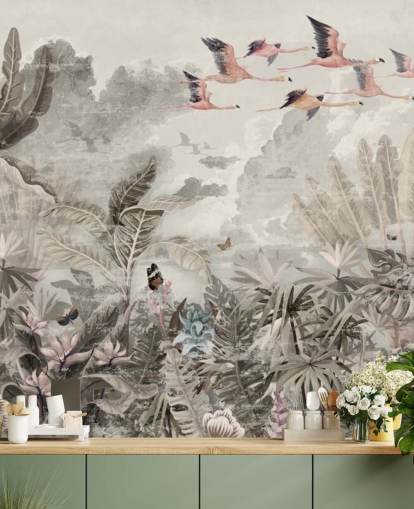 Muted green palm trees and jungle trees with light pink flowers and flying pink flamingo birds wallpaper
