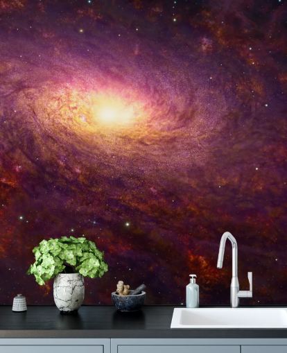 Dark purple swirling galaxy with red swirls and stars with a bright center wallpaper