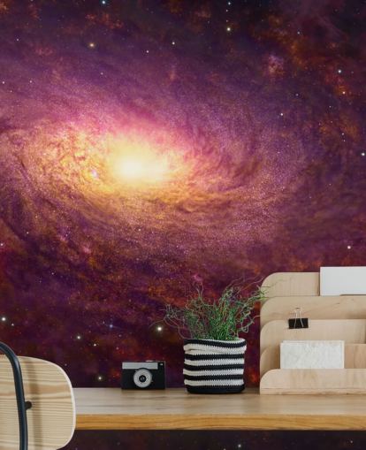 Dark purple swirling galaxy with red swirls and stars with a bright center wallpaper