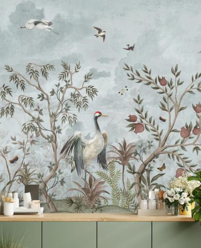 Blue, watercolor sky with growing trees and vines with dark pink roses, flying birds and white and blue egret birds in a chinoiserie style wallpaper