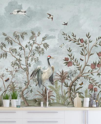 Blue, watercolor sky with growing trees and vines with dark pink roses, flying birds and white and blue egret birds in a chinoiserie style wallpaper