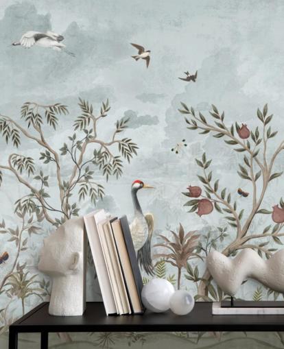 Blue, watercolour sky with growing trees and vines with dark pink roses, flying birds and white and blue egret birds in a chinoiserie style wallpaper