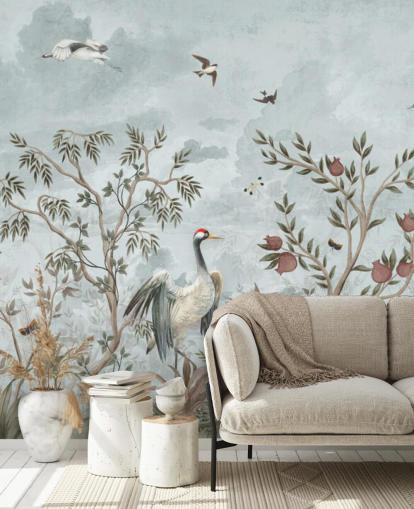 Blue, watercolour sky with growing trees and vines with dark pink roses, flying birds and white and blue egret birds in a chinoiserie style wallpaper