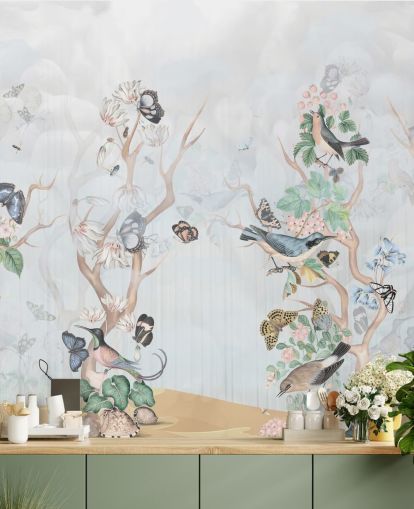 Light blue background with chinoiserie style trees with birds and butterflies