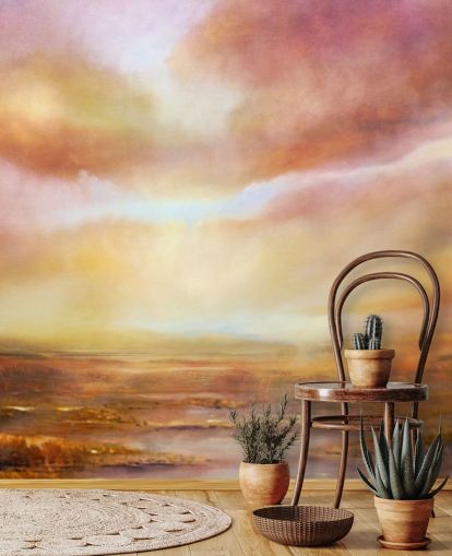 Abstract painting of a yellow and pink landsape with the sun shining through the clouds