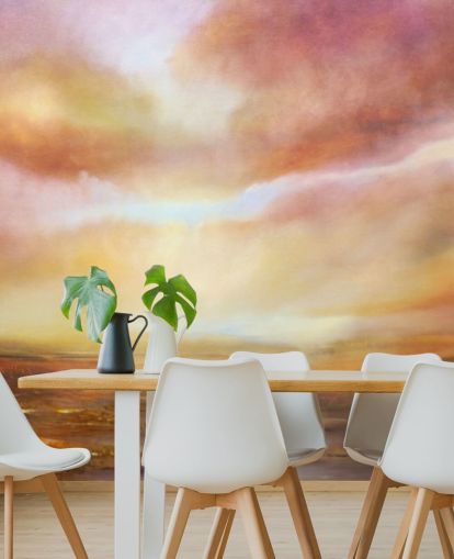 Abstract painting of a yellow and pink landsape with the sun shining through the clouds