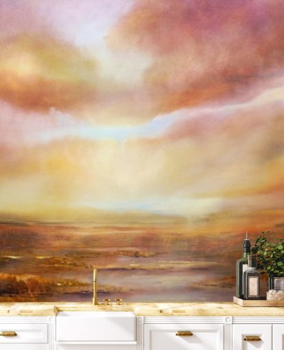 Cuadro abstracto de un paisaje amarillo y rosa con el sol brillando entre las nubes