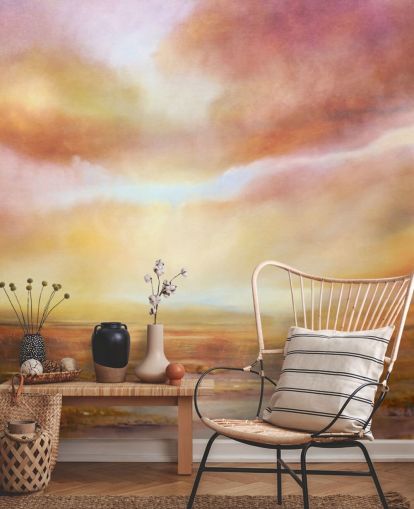 Abstract schilderij van een geel en roze landschap met de zon die door de wolken schijnt Abstract schilderij van een geel en roze landschap met de zon die door de wolken schijnt