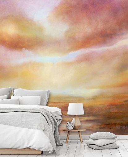 Cuadro abstracto de un paisaje amarillo y rosa con el sol brillando entre las nubes