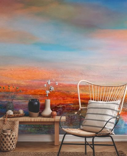 Peinture abstraite colorée représentant un coucher de soleil avec des rouges, des bleus et des jaunes