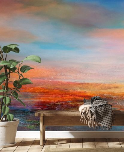 Peinture abstraite colorée représentant un coucher de soleil avec des rouges, des bleus et des jaunes