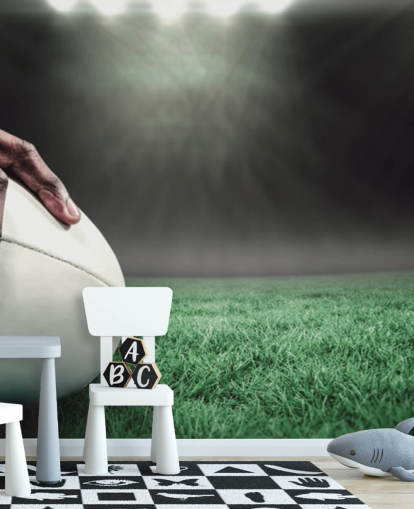 papel de parede de rugby personalizado verde e preto chamado Hand on Rugby Ball para quartos infantis