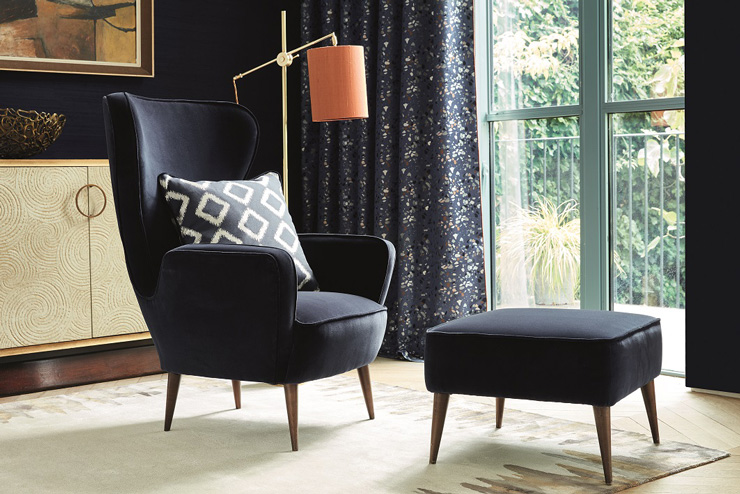 navy chair and footstool in living room