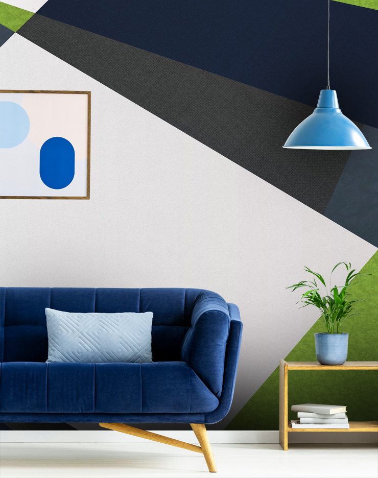 navy geometric wallpaper in living room with blue sofa