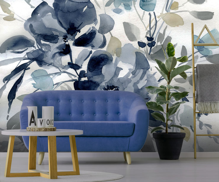 navy floral wallpaper in living room with blue sofa