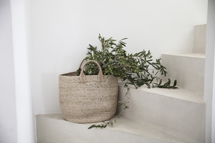 storage basket on the stairs in a home