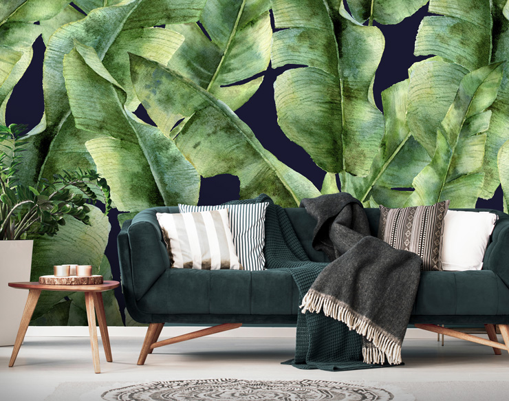 navy and green leaf wallpaper in dark lounge