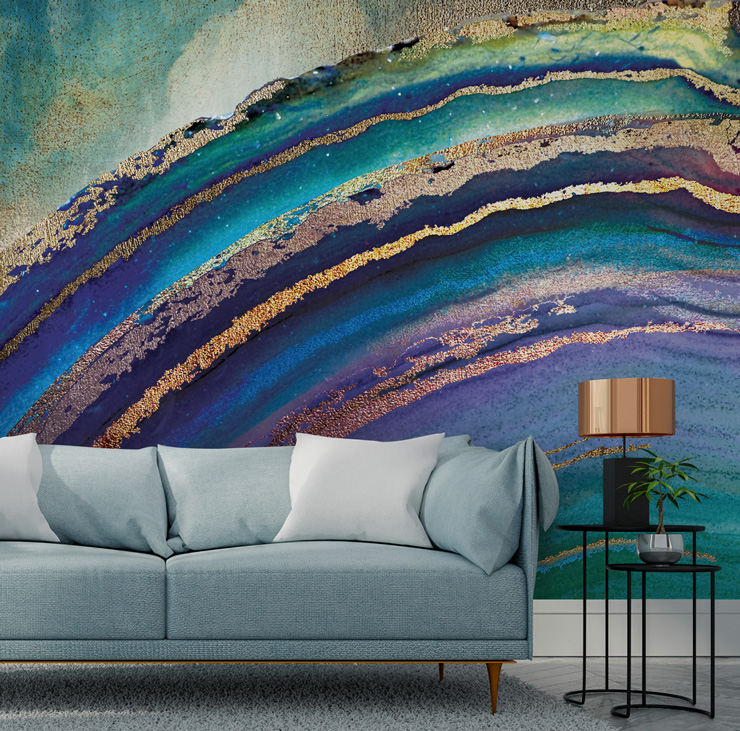 blue and bronze agate wallpaper behind grey sofa