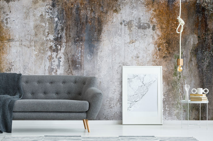 concrete and rust wallpaper in modern grey living room