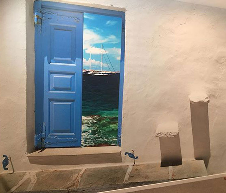greek open blue shutters to sea view wallpaper in simple bedroom
