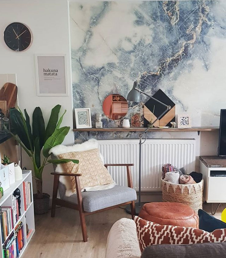 blue and white marble mural in natural wood scandi lounge