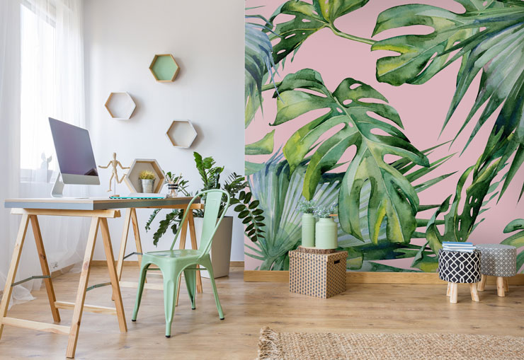 palm leaf on pink wallpaper in home office