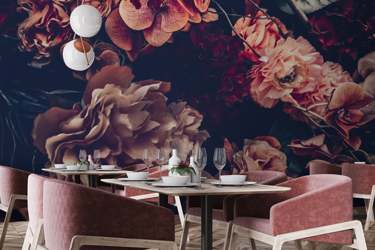 pink and purple dark flower wallpaper in restaurant with dusty pink comfy chairs