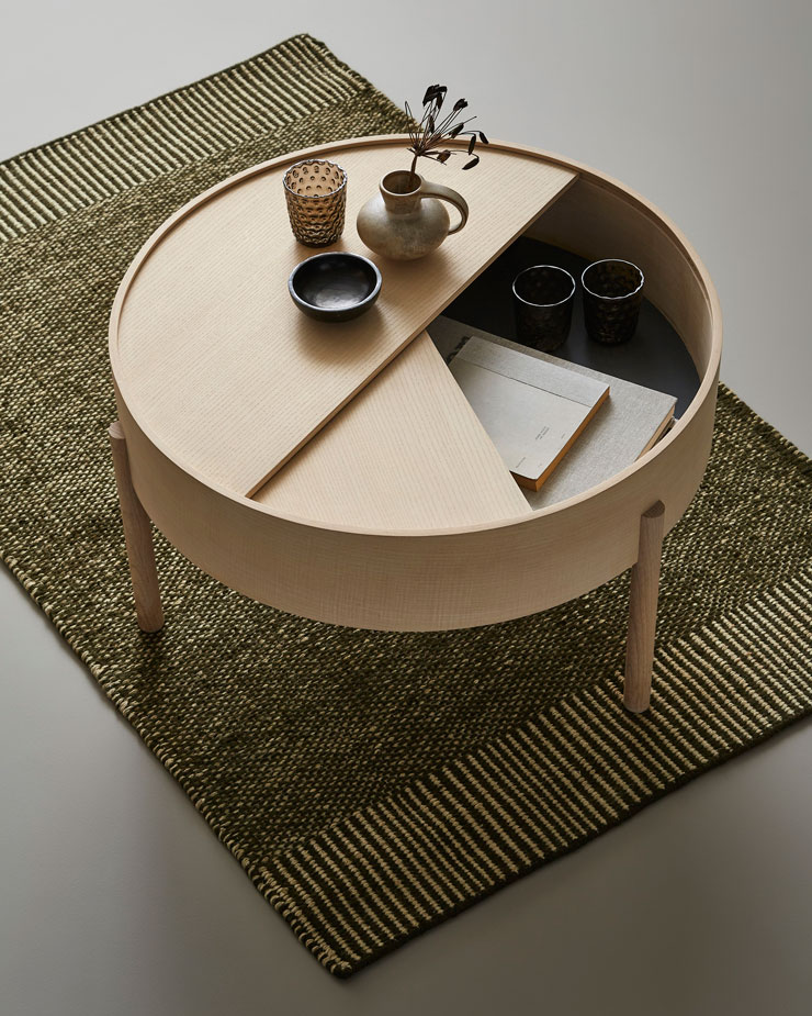 natural wood circular coffee stable with geometric sliding top for storage