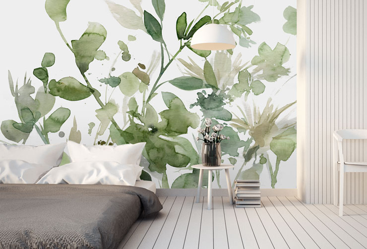 leafy green watercolour floral pattern wallpaper in minimalist bedroom