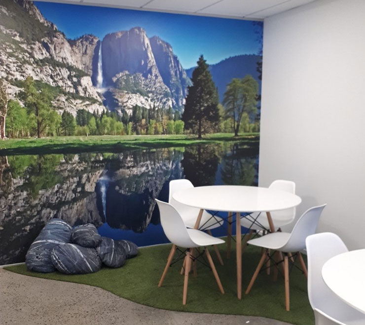mountain and lake wallpaper in nature themed staff room