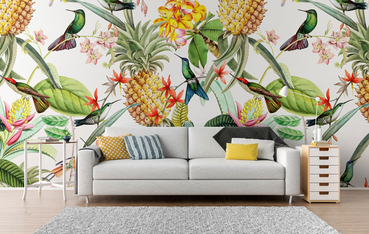 colourful bird and pineapple illustrated wallpaper in light lounge