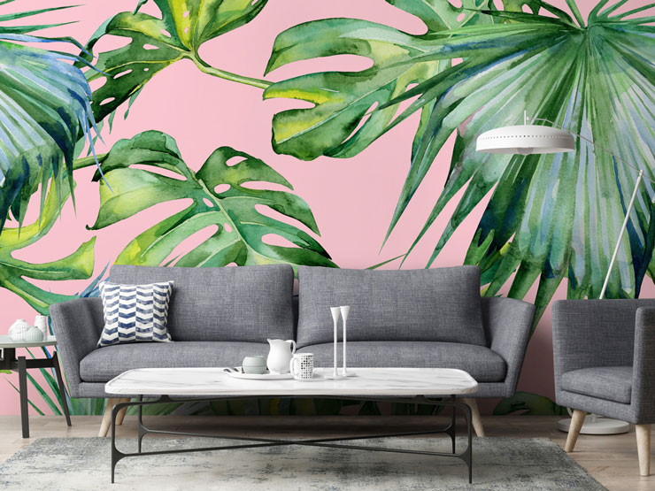 palm leaf against pink background wall mural in grey lounge