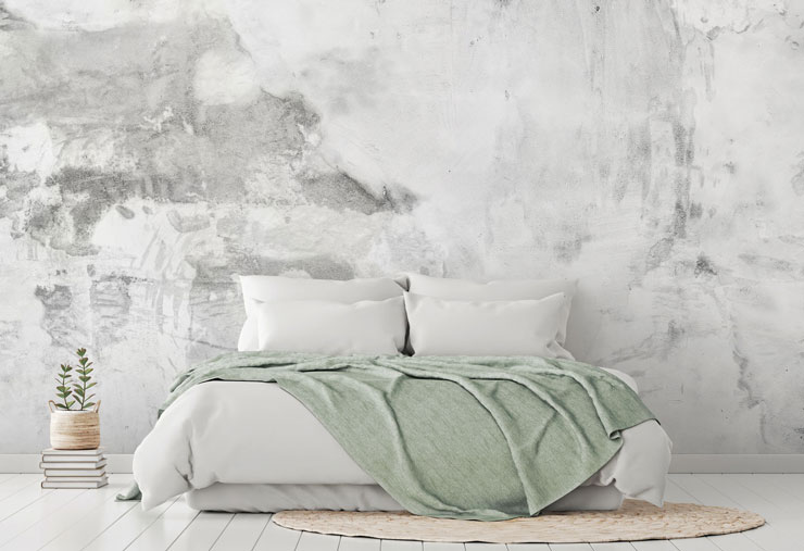 pale white and grey plaster textured wall mural in pale sage and white bedroom
