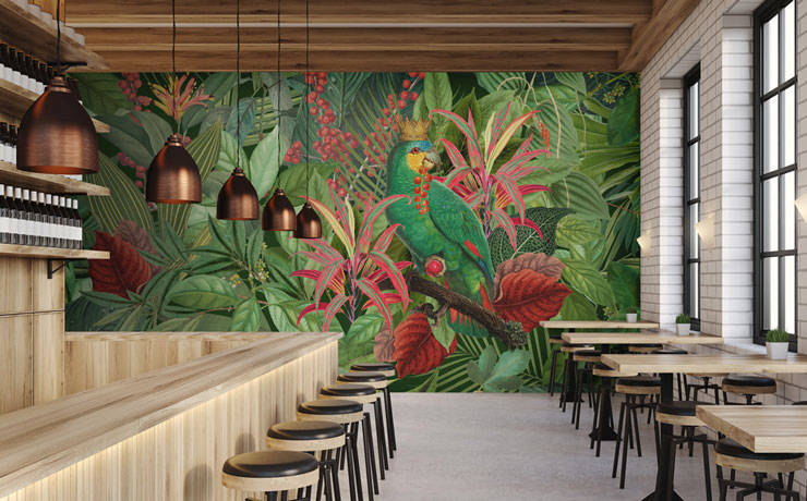 illustrated parrot wearing crown in green and pink jungle wall mural in industrial trendy restaurant