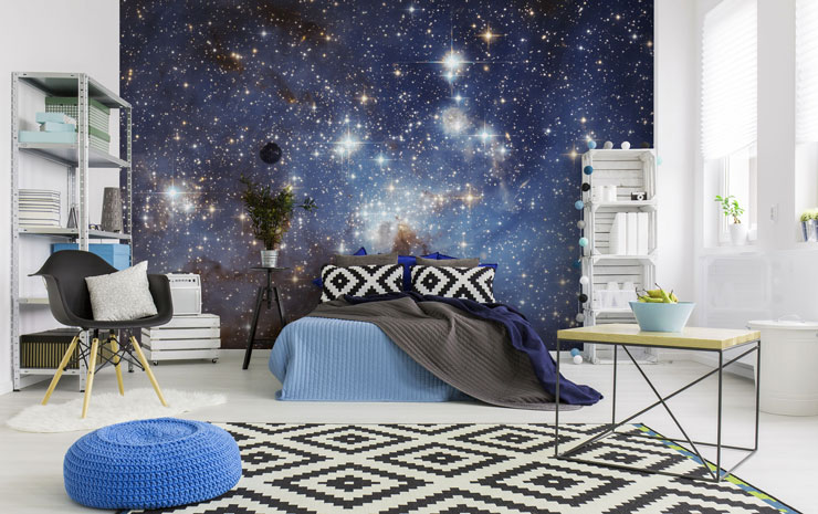 blue starry galaxy sky wall mural in trendy open loft bedroom