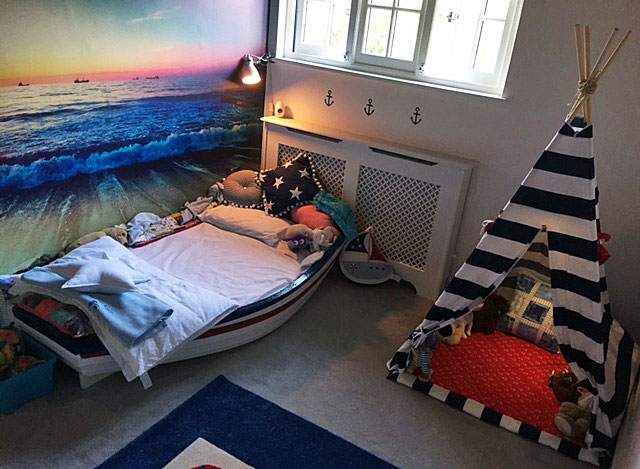 calming sunset beach wall mural in child's pirate bedroom