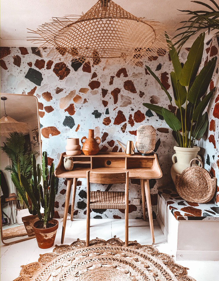 white, brown and black speckled terrazzo in stylish room with wicker furniture