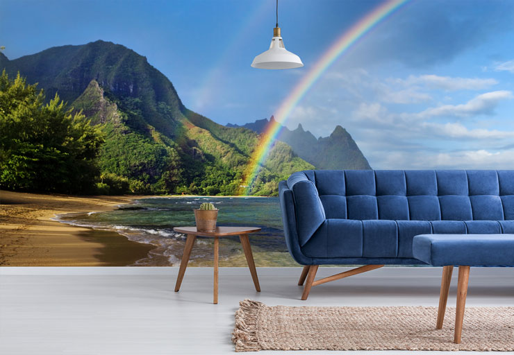 rainbow over tropical beach wall mural in trendy blue living room