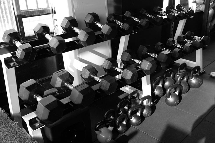 black and white photograph of stacked weights