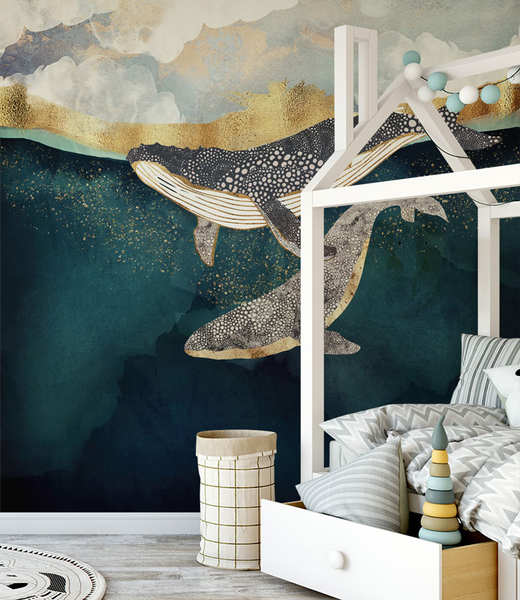 whales swimming in abstract navy and gold effect wallpaper in child's nursery