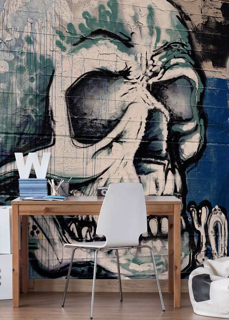 blue, white and black skull graffiti wall mural in teenage boy's desk area