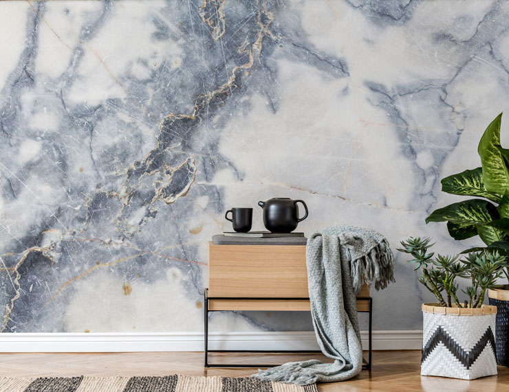 blue and white marble wall mural in trendy lounge